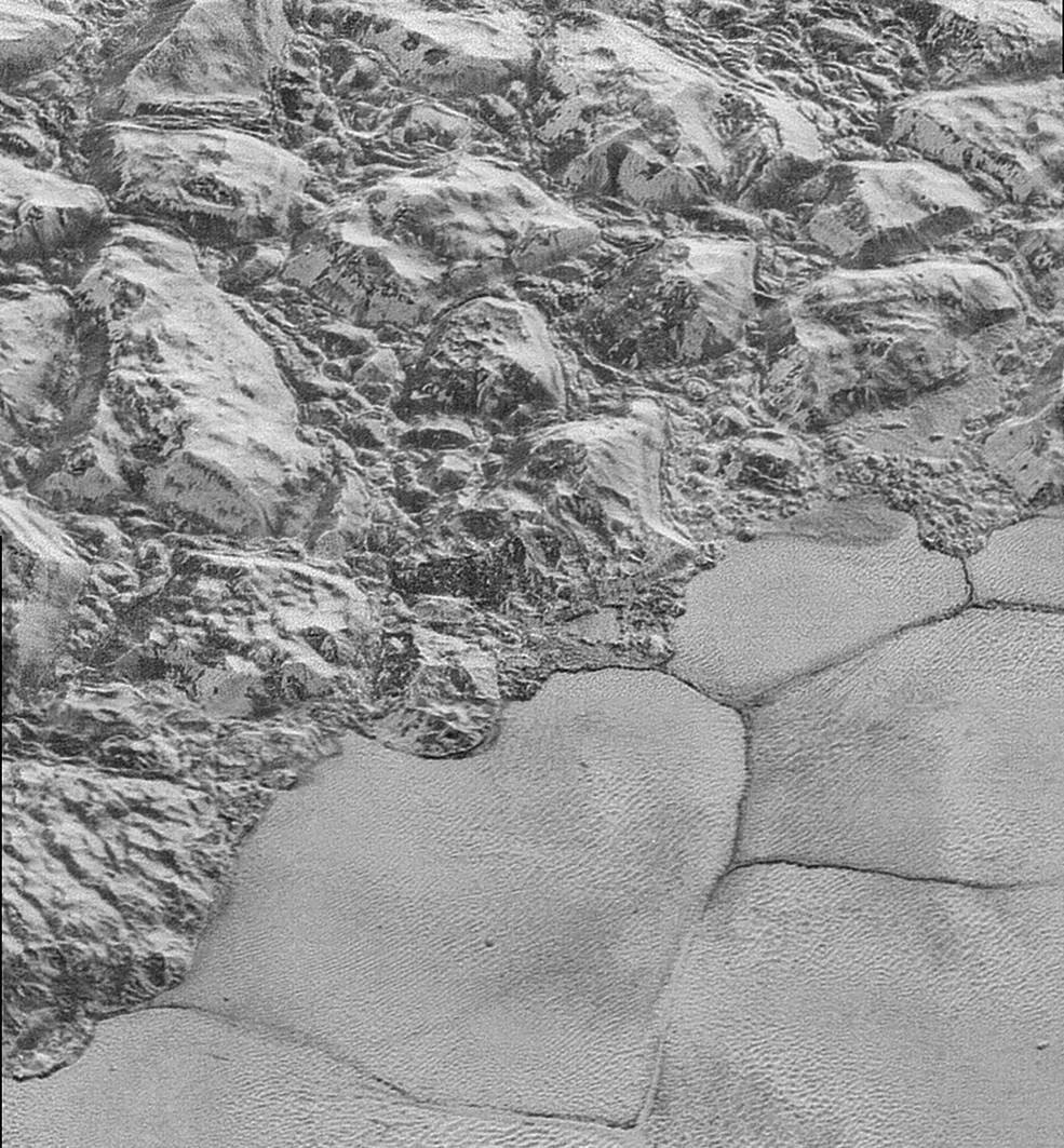 The mountainous shoreline of Pluto's icy plain known as Sputnik Planum